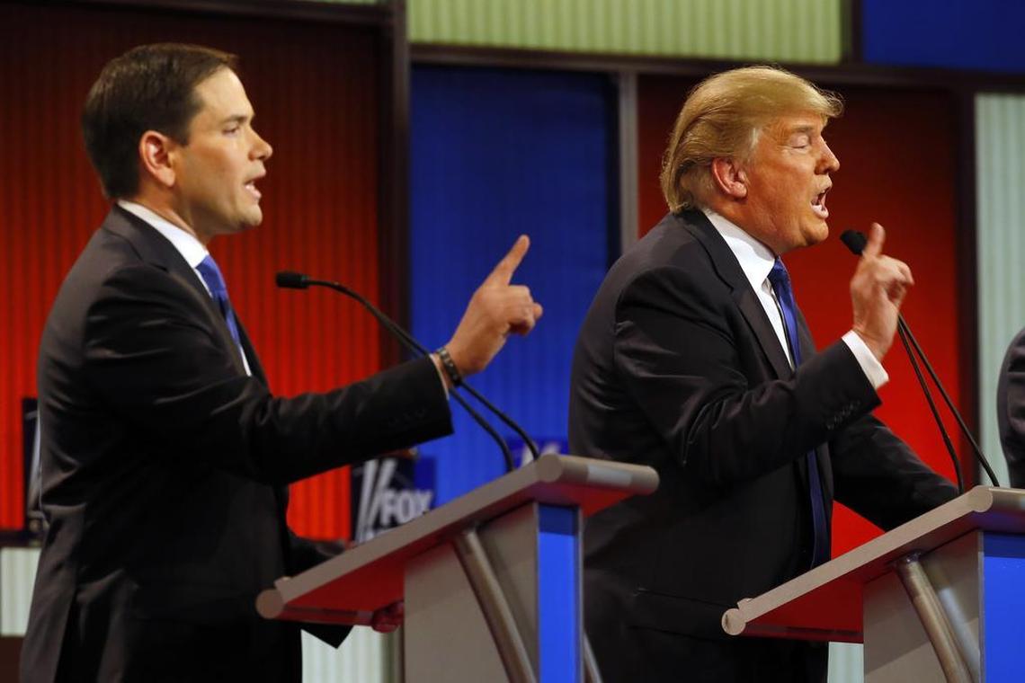 Sen. Marco Rubio, R-Fla., and then-candidate Donald Trump argue during a Republican presidential primary debate at Fox Theatre, Thursday, March 3, 2016, in Detroit.