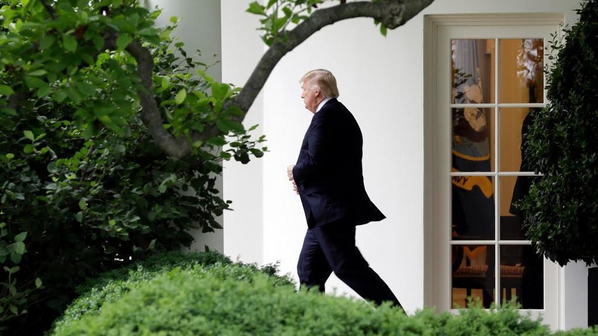 President Donald Trump walks from the Oval Office to the Marine One helicopter Thursday, May 4, 2017, as he leaves the White House in Washington, en route to New York City. Trump fired FBI Director James Comey on Tuesday just 24 hours after his former top national security aide, Michael Flynn – and, by extension, his own diligence concerning Flynn’s behavior, was publicly put through the wringer – raises questions of political payback.