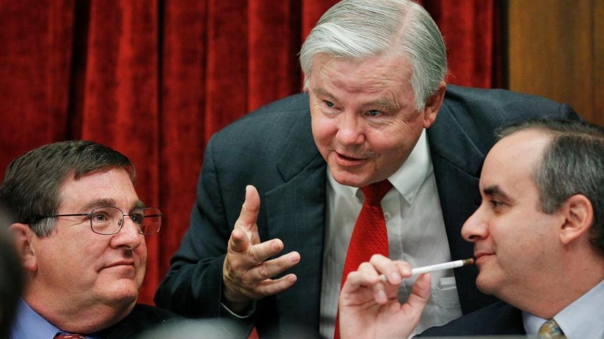 Rep. Joe Barton, R-Texas, center, confers with subcommittee ranking member Rep. Michael Burgess, R-Texas, left, and unidentified counsel, right, during a joint House subcommittees' hearing of Oversight and Investigations and of Energy and Environment regarding the role of the Interior Department in the Deepwater Horizon disaster, on Capitol Hill in Washington, Tuesday, July 20, 2010.