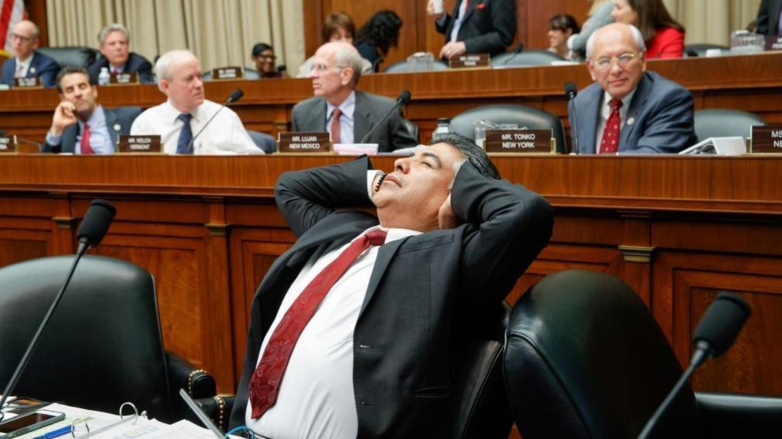 After working through the night, House Energy and Commerce Committee member Rep. Tony Cardenas, D-Calif., stretches while members of the committee argue the details of the GOP's "Obamacare" replacement bill, Thursday, March 9, 2017, on Capitol Hill in Washington.