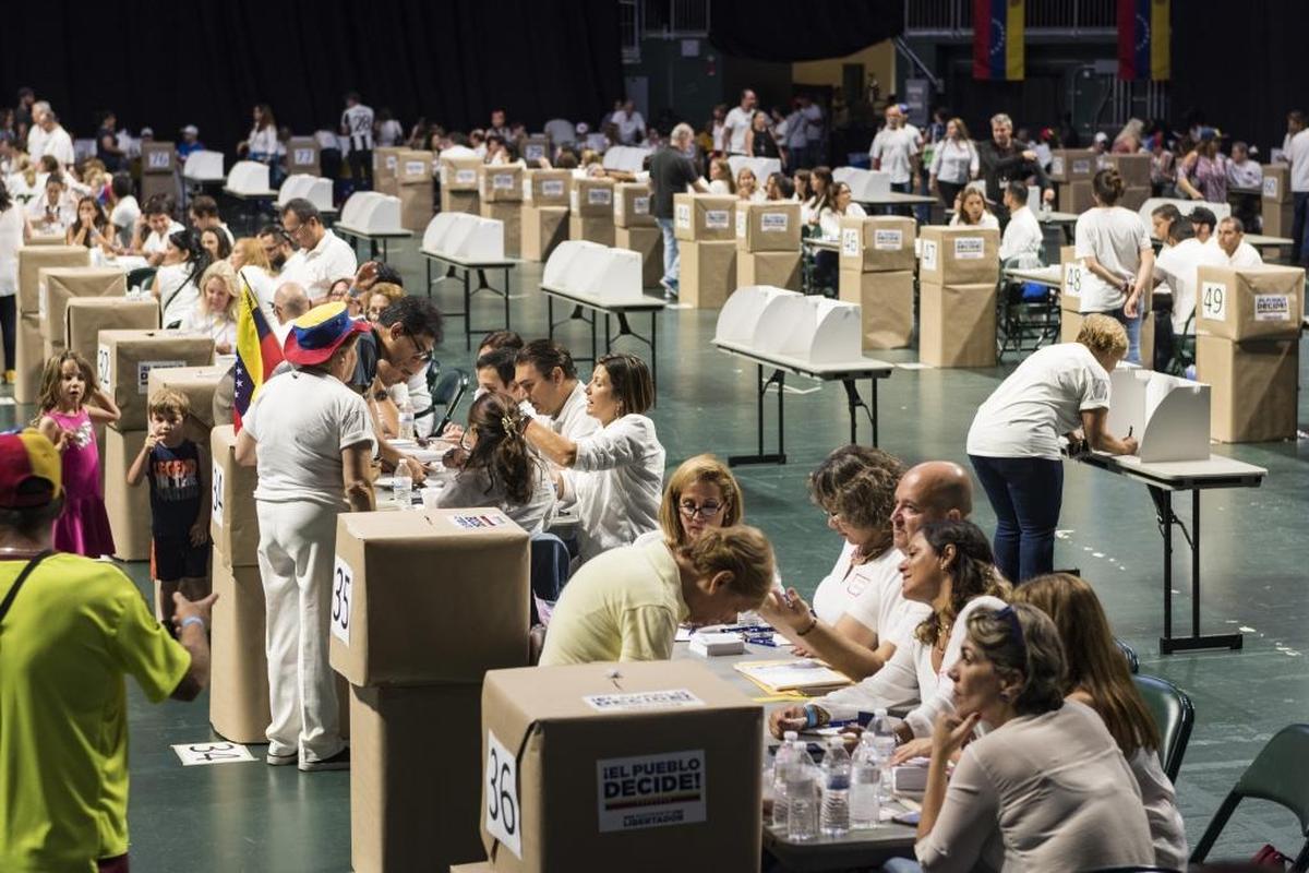 Venezuelans cast ballots in an informal referendum last Sunday at the Watsco Center in Coral Gables.