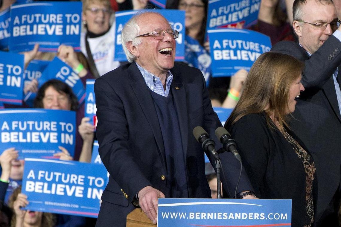 Democratic presidential candidate Sen. Bernie Sanders, I-Vt., laughs as he arrives with his wife Jane Sanders, and his son Levi Sanders to a primary night rally in Essex Junction, Vt., Tuesday, March 1, 2016, on Super Tuesday.
