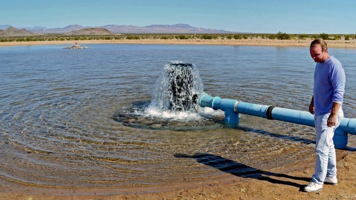 Scott Slater, CEO of the Cadiz water project, stands near a basin at the project site near Needles, California, Slater and Cadiz have recently gotten a big boost by a Trump administration decision that relieves the project of a federal environmental review requirement.