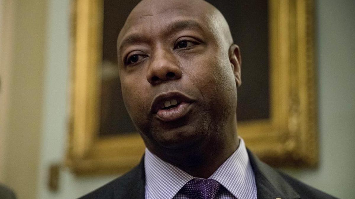 Sen. Tim Scott, R-S.C., speaks to members of the media as he arrives for a closed-door Republican policy luncheon on Capitol Hill in Washington, Nov. 16, 2016.