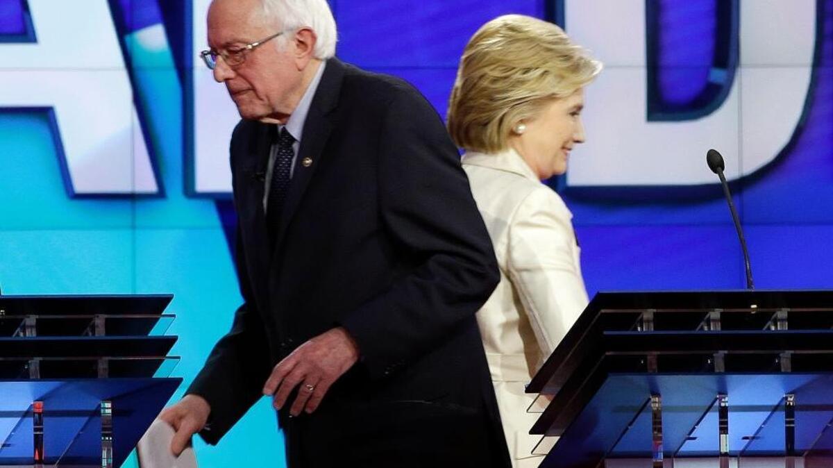 Democratic presidential candidates Sen. Bernie Sanders of Vermont and former Secretary of State Hillary Clinton, at the CNN Democratic presidential primary debate on Thursday, April 14, 2016, in New York. The two agree on many health care issues, but there are a few areas where they don’t see eye-to-eye.