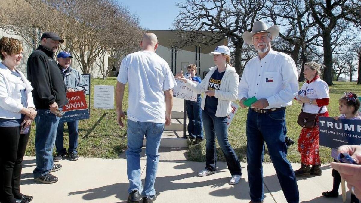 A voter makes his way to a polling station at Concordia Lutheran Church in the suburban community of Bedford, Texas, on March 1, 2016.