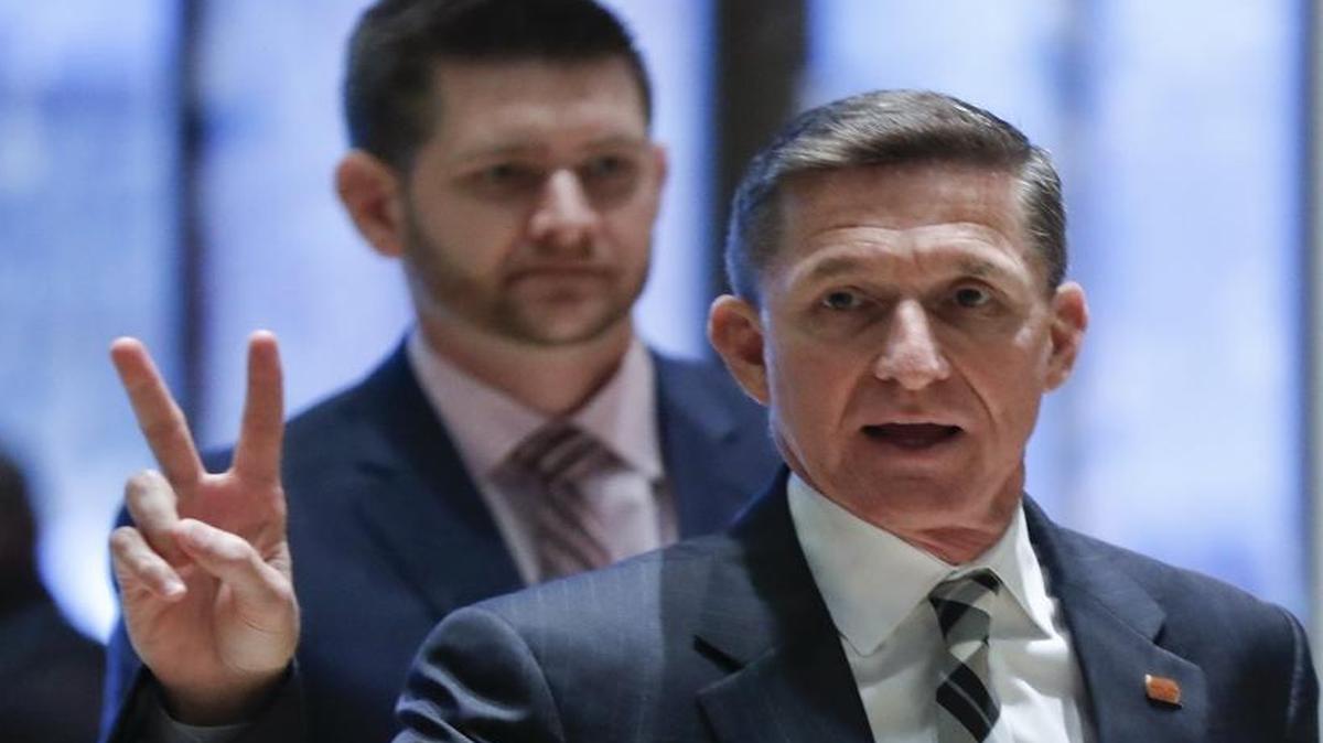 Retired Lt. Gen Michael Flynn gestures as he arrives at Trump Tower, Thursday, Nov. 17, 2016, in New York.