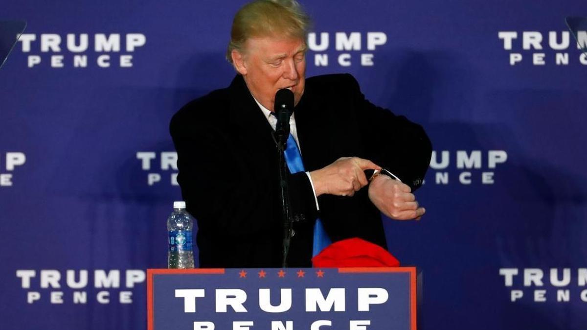 Republican presidential candidate Donald Trump looks at his watch while speaking at a rally Monday, Nov. 7, 2016 in Leesburg, Va. Trump was checking to see that it Monday, and only one more day before Election Day.