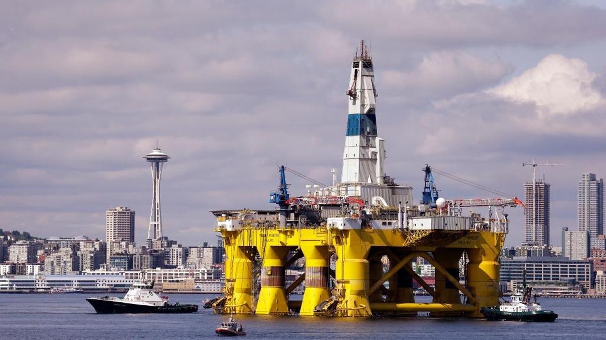 FILE - In this May 14, 2015, file photo, the oil drilling rig Polar Pioneer is towed toward a dock in Elliott Bay in Seattle. The rig was outfitted for Arctic oil exploration (AP Photo/Elaine Thompson, File)