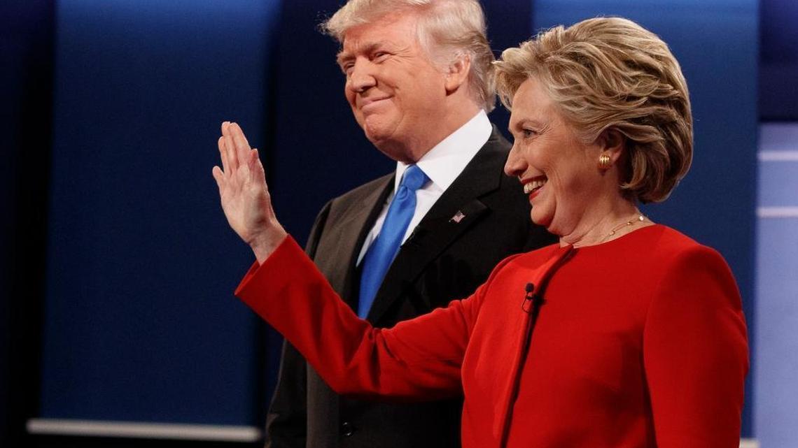 Republican presidential candidate Donald Trump, left, stands with Democratic presidential candidate Hillary Clinton before the first presidential debate at Hofstra University, Monday, Sept. 26, 2016, in Hempstead, N.Y.