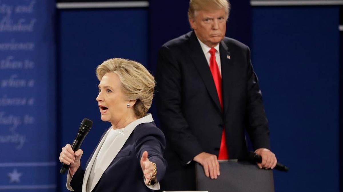 Republican presidential nominee Donald Trump looks at Democratic presidential nominee Hillary Clinton as she answers a question during the second presidential debate at Washington University in St. Louis, Sunday, Oct. 9, 2016. Not pictured is popular third-party candidate Sweet Meteor O’ Death.