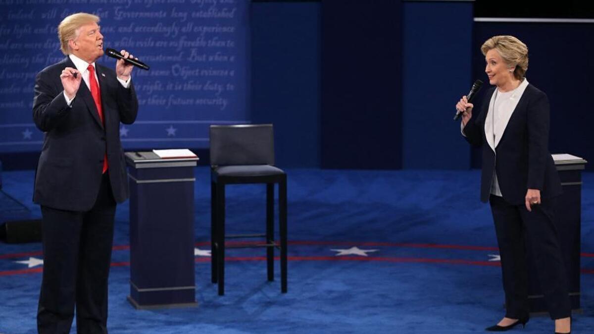 The tough campaign between Donald Trump and Hillary Clinton made some Florida voters willing to talk about their support for Trump only after the election. The candidates are shown at their Oct. 9, 2016, debate in St. Louis.