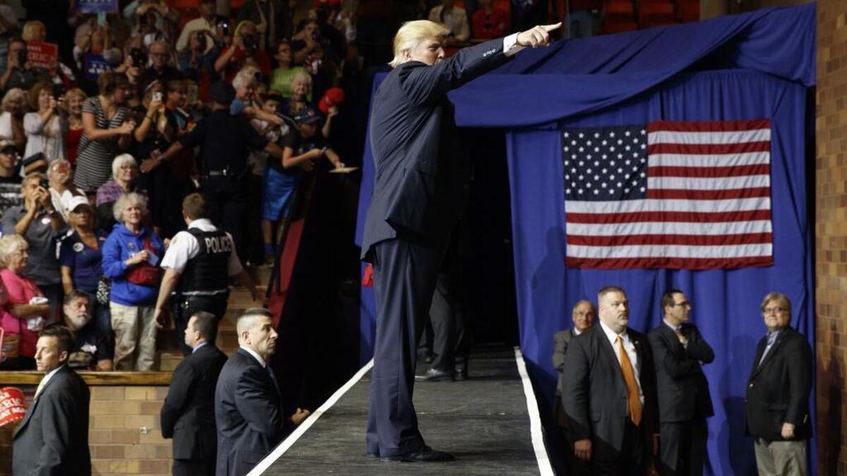 Republican presidential candidate Donald Trump walks offstage during a rally, Wednesday, Sept. 14, 2016, in Canton, Ohio.