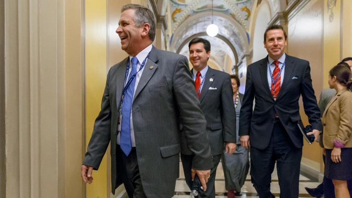 From left, Rep.-elect Mike Bost of Illinois, Rep.-elect David Rouzer of North Carolina and Rep.-elect Mark Walker of North Carolina leave an orientation luncheon for newly elected GOP members of the House on Capitol Hill in Washington, Nov. 17, 2014.