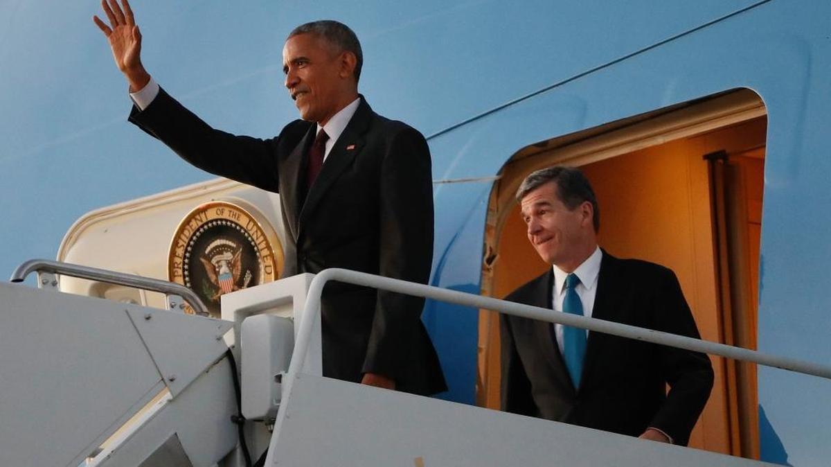 President Barack Obama, left, and North Carolina Democratic gubernatorial candidate Roy Cooper, right, arrive together at North Carolina Air National Guard Base in Charlotte. North Carolina is a key state to watch as returns come in Tuesday night.