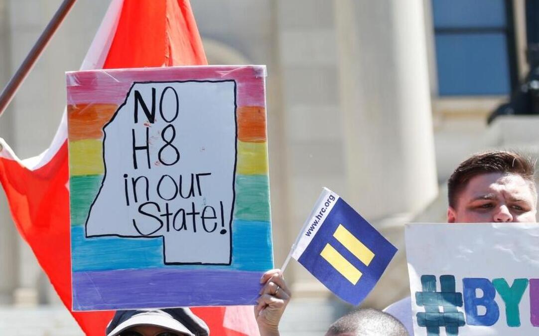 LGBT activists waved flags and signs in July after a federal judge blocked a Mississippi law that allowed those who cited religious beliefs to refuse services to gay couples. Opponents of gay marriage are counting on help from President-elect Donald Trump to get Congress to pass a federal bill that addresses the same subject.