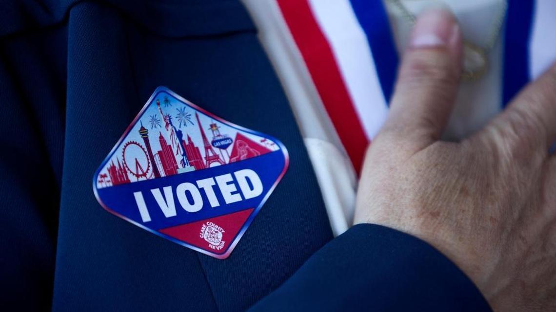Nevada U.S. Senate Democratic candidate, Catherine Cortez Masto, wears a sticker after voting at an early voting site in a Cardenas supermarket in Las Vegas, Wednesday, Nov. 2, 2016.