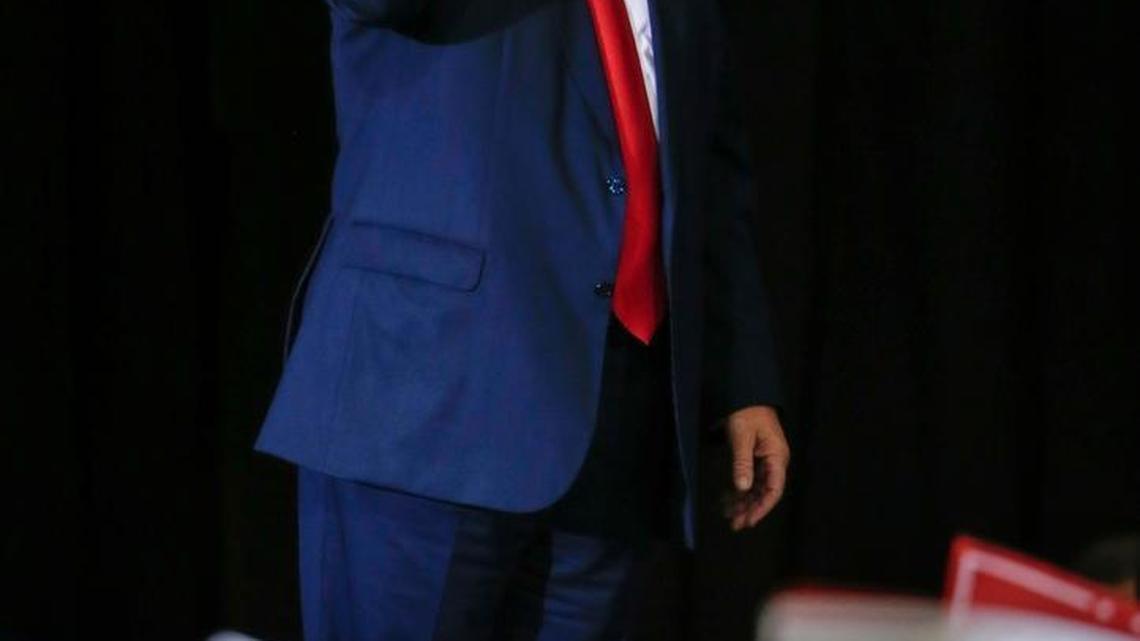 Republican presidential candidate Donald Trump raises his fist after speaks at a campaign rally in Grand Rapids, Mich., Monday, Oct. 31, 2016.