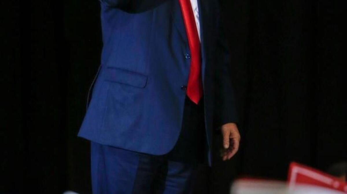 Republican presidential candidate Donald Trump raises his fist after speaks at a campaign rally in Grand Rapids, Mich., Monday, Oct. 31, 2016.