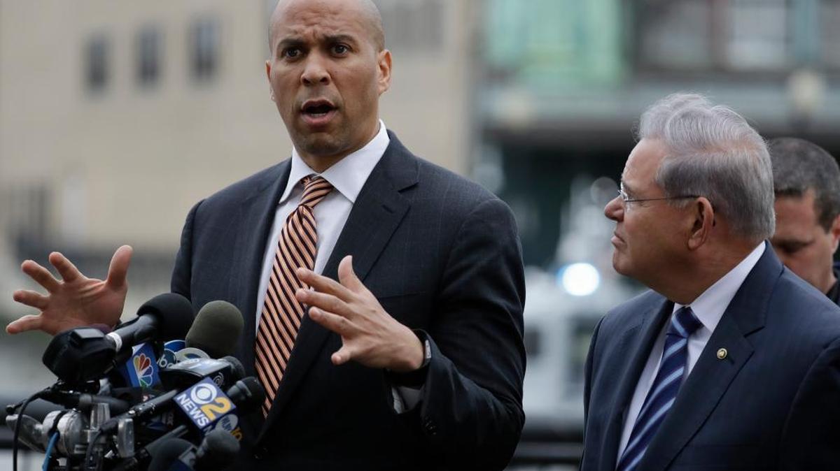 FILE – Democratic U.S. Sens. Cory Booker, left, and Bob Menendez of New Jersey. Booker and Menendez took a pass this week on joining other Democrats to call for the LPGA to boycott Donald Trump’s Bedminster, N.J., golf club for next year’s Women’s Open.