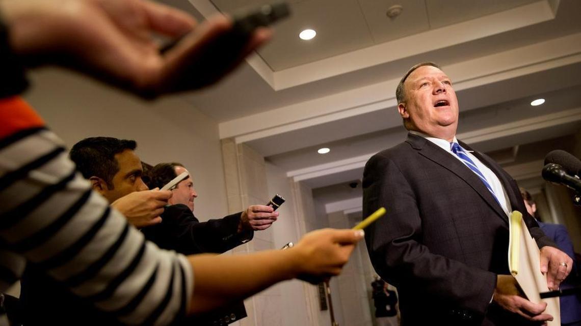 Reporters hold out recorders as House Benghazi Committee member Rep. Mike Pompeo, R-Kan., speaks to the media on Capitol Hill in Washington, Oct. 16, 2015.
