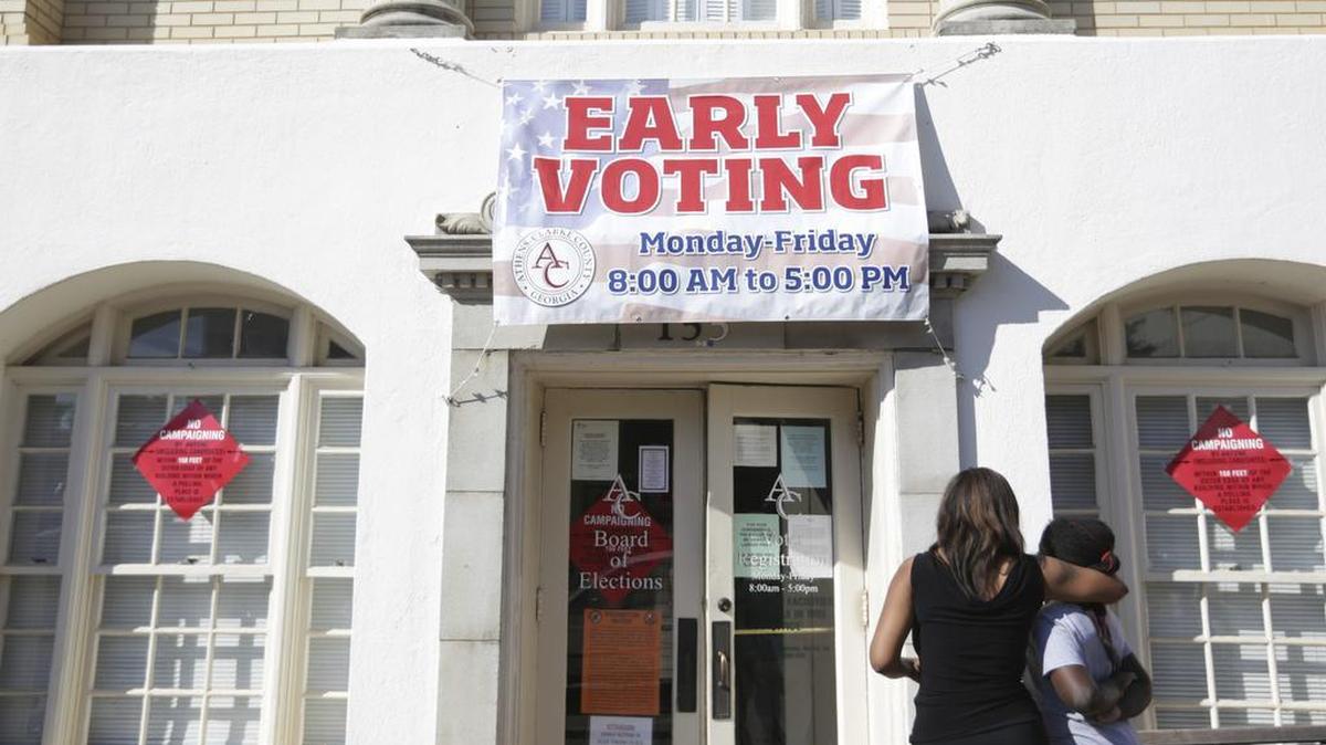 Residents arrive to cast their ballots early for the general election in downtown Athens, Ga., Tuesday, Oct. 25, 2016.