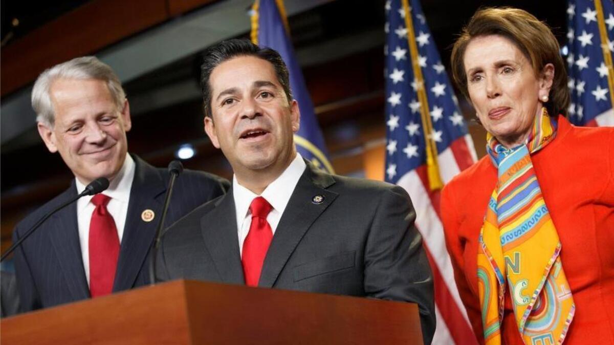 Rep. Ben Ray Lujan, D-N.M., center, with House Minority Leader Nancy Pelosi, right, and Rep. Steve Israel, D-N.Y. on Nov. 17, 2014. Lujan heads the Democratic Congressional Campaign Committee.