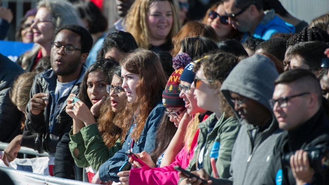 Students sing along to music as they wait for President Barack Obama to speak at a campaign rally for Democratic presidential candidate Hillary Clinton, Friday, Oct. 14, 2016, at the Cleveland Burke Lakefront Airport.