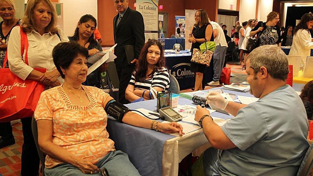 A blood pressure check at the South Florida Hispanic Chamber of Commerce Latino Health and Wellness Expo in 2015.
