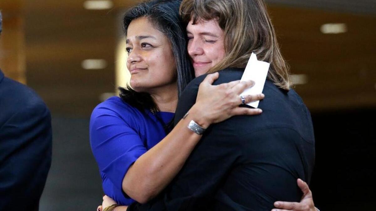 Washington state Rep.-elect Pramila Jayapal, left, the first Indian-American woman elected to the U.S. House of Representatives, embraces Nicole Grant, leader of the Seattle Labor Council, at a post-election event on Nov. 9, 2016, at City Hall in Seattle. The 51-year-old Seattle Democrat came to the United States from India when she was 16 and is prepared to do battle with President-elect Donald Trump over immigration.