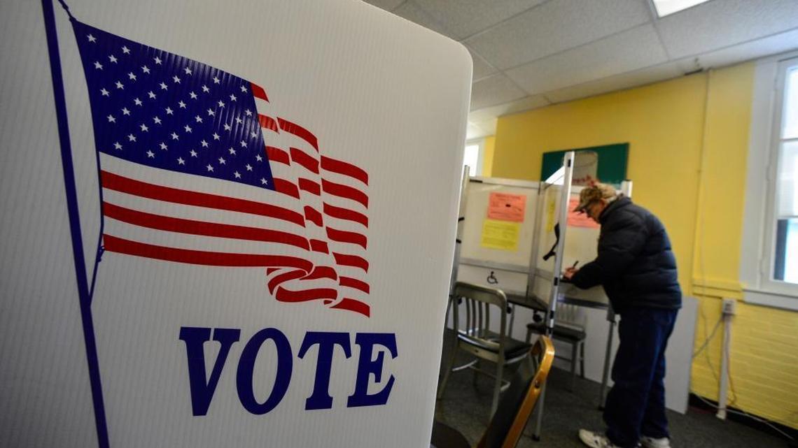 Gene Riley, of Brattleboro, Vt., fills out his ballot at the town clerk office in the municipal building during early voting on Wednesday, Oct. 26, 2016, in Brattleboro.