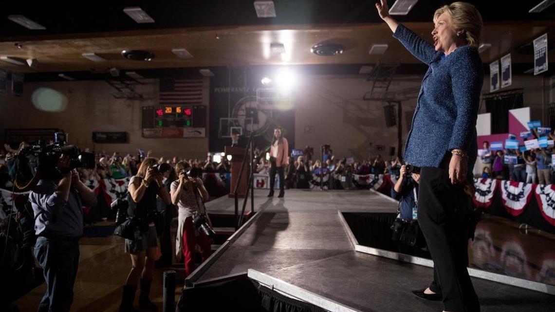 Democratic presidential candidate Hillary Clinton takes the stage at a rally at Theodore Roosevelt High School in Des Moines, Iowa, Friday, Oct. 28, 2016.