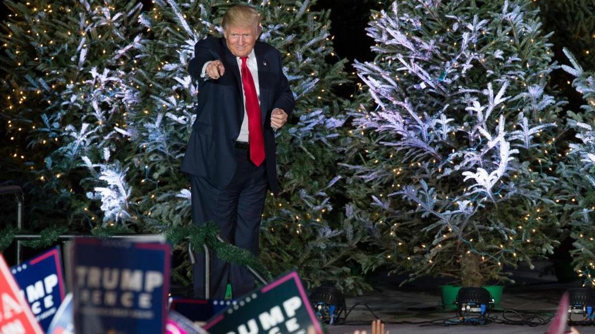 President-elect Donald Trump points into the audience after a rally in Orlando, Fla., Friday, Dec. 16, 2016.