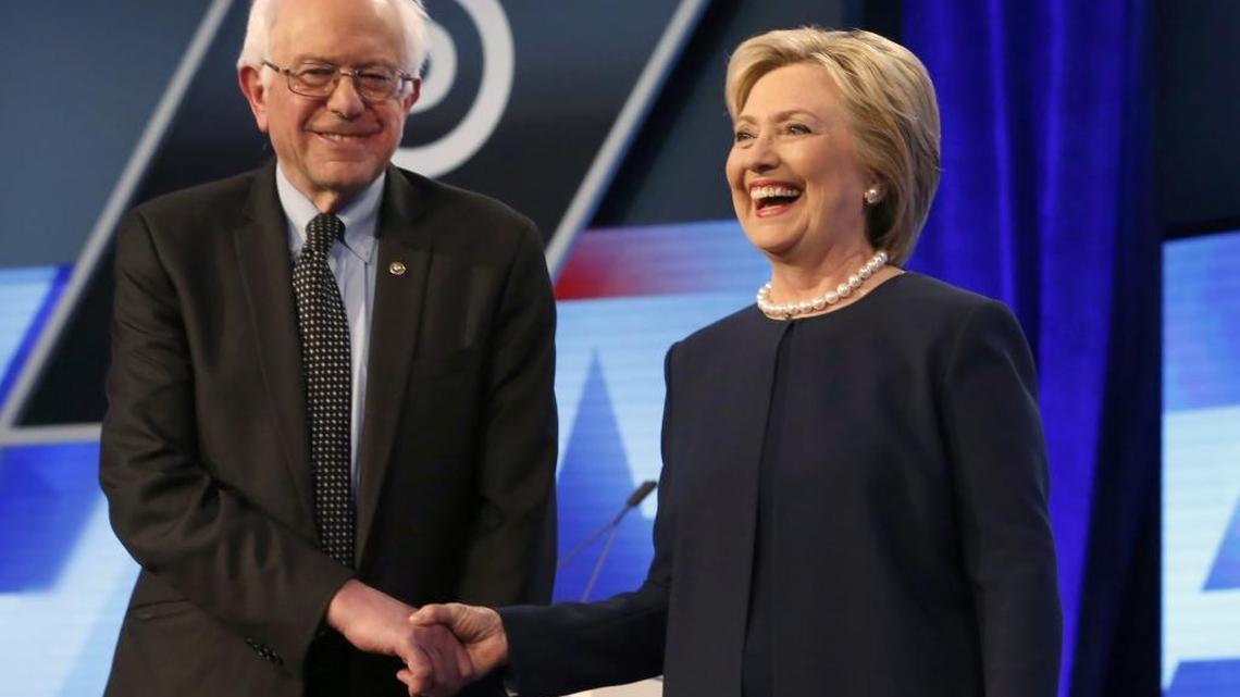 Democratic presidential candidates, Hillary Clinton and Sen. Bernie Sanders, I-Vt, shake hands before the start of the Univision, Washington Post Democratic presidential debate at Miami-Dade College, March 9, in Miami.