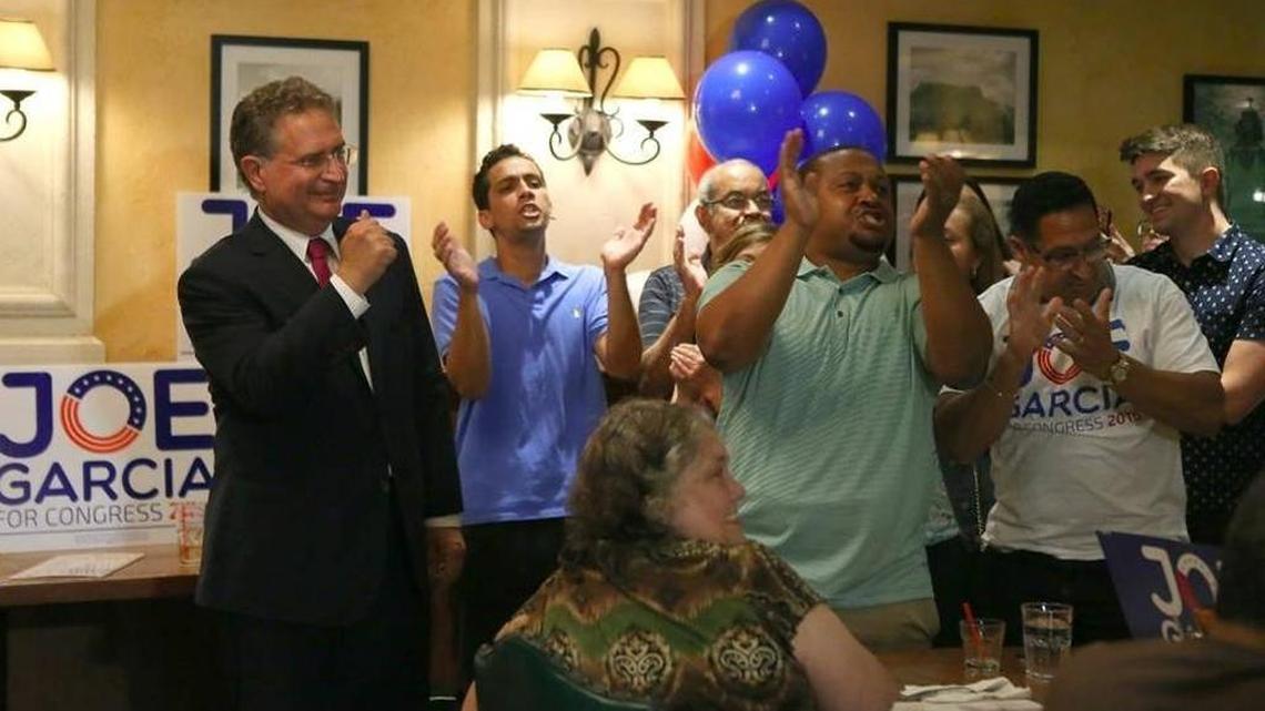 Former U.S. Rep. Joe Garcia, left, celebrated his primary victory with supporters at La Carreta restaurant in West Kendall. His win set up a rematch with Rep. Carlos Curbelo, who defeated him in 2014.