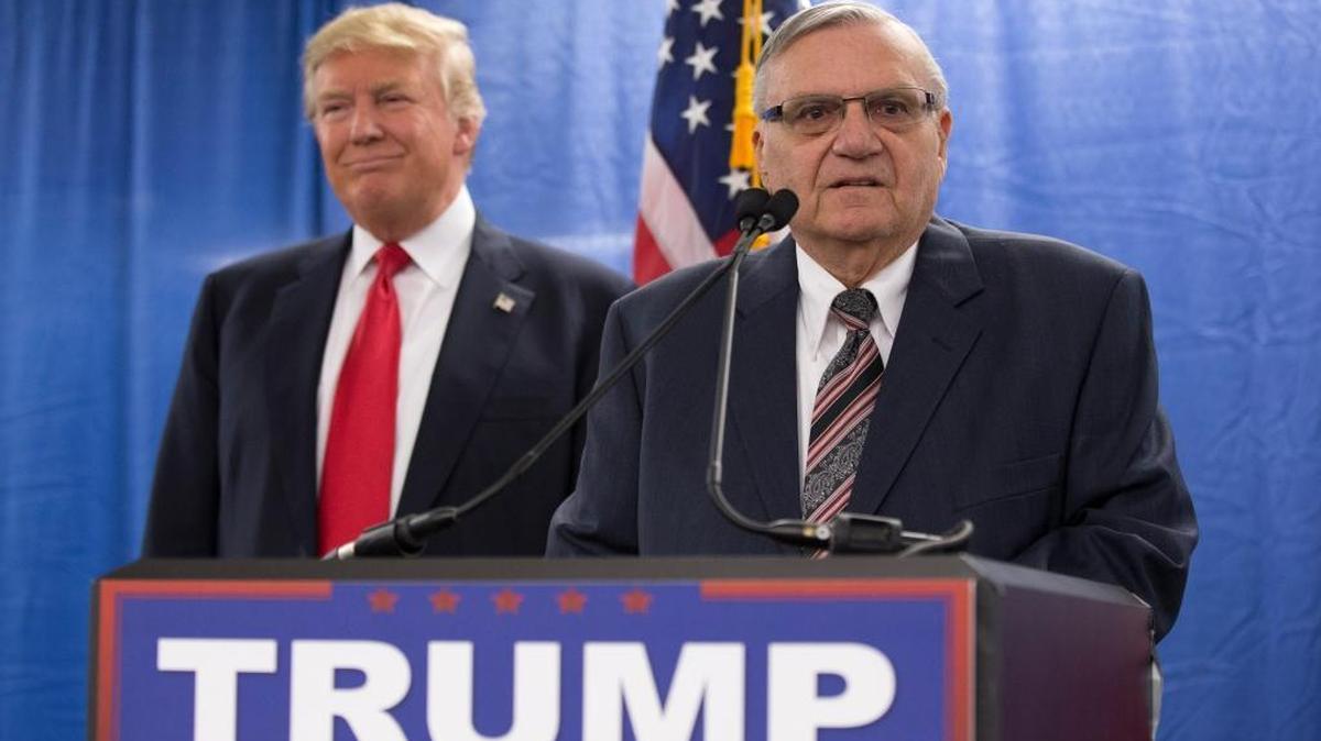 Republican presidential candidate Donald Trump, left, is joined by Maricopa County, Ariz., Sheriff Joe Arpaio during a new conference at the Roundhouse Gymnasium, Tuesday, Jan. 26, 2016, in Marshalltown, Iowa.