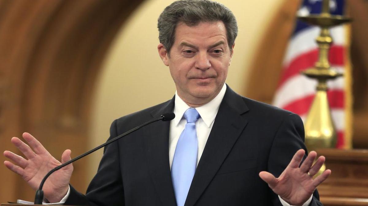 Kansas Gov. Sam Brownback speaks to the legislature in Topeka, Kan. Kansas. Jan. 12, 2016