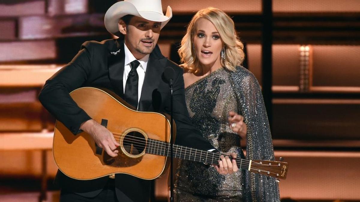 Hosts Brad Paisley, left, and Carrie Underwood speak at the 50th annual CMA Awards at the Bridgestone Arena on Wednesday in Nashville, Tennessee.