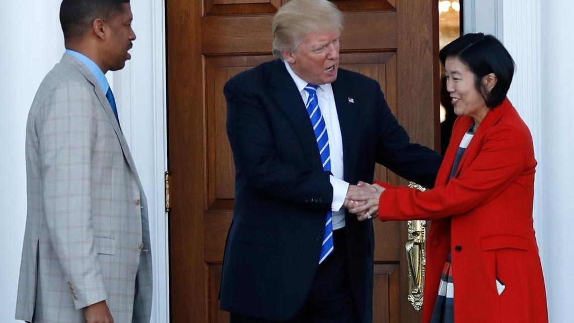 President-elect Donald Trump shakes hands with Michelle Rhee, a former chancellor of Washington, D.C. Rhee and her husband, outgoing Sacramento Mayor Kevin Johnson, met with Trump at the Trump National Golf Club Bedminster in Bedminster, N.J.