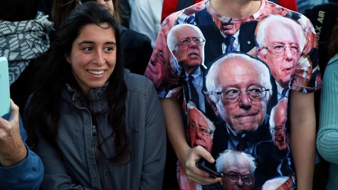 Supporters smile at the arrival of independent Vermont Sen. Bernie Sanders to speak at a rally in support of Colorado Amendment 69, a ballot measure to set up the nation's first universal health-care system, on campus of the University of Colorado, in Boulder, Colo., Oct. 17, 2016. Amendment 69 would repeal the current health insurance system and make coverage universal.