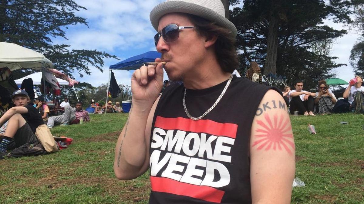 From California to Florida, millions of Americans in nine states will vote Tuesday on whether to expand legal access to marijuana. Collectively, the ballot measures amount to the closest the U.S. has come to a national referendum on the drug. In this photo Shane Kinoshita of San Francisco smokes marijuana in Golden Gate Park on April 20, 2016.