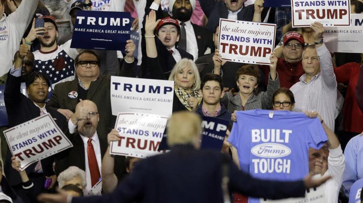 Republican presidential candidate Donald Trump looks at the crowd as he speaks at a Cleveland campaign rally Saturday. A video posted over the weekend shows an unidentified man telling protesters outside the rally to “Go to Auschwitz” and appearing to throw a Nazi salute.