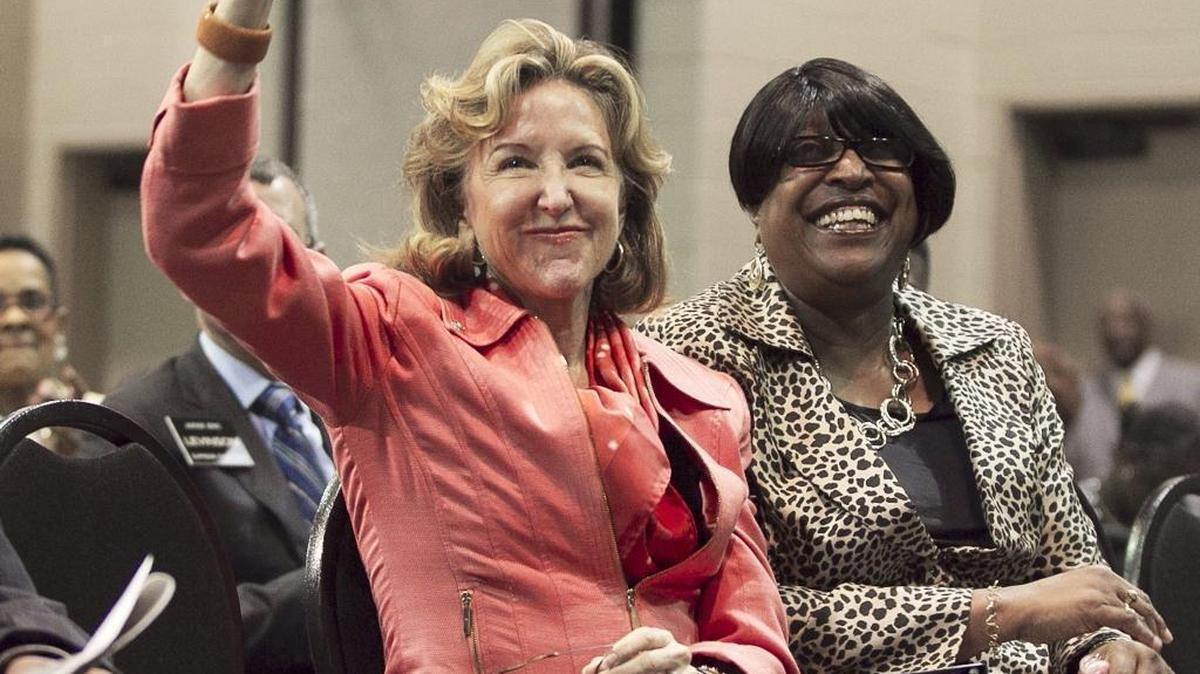 FILE – U.S. Sen. Kay Hagan acknowledges the crowd upon her introduction at the 147th Annual Session of the General Baptist State Convention on October 29, 2014, at the Greenville Convention Center in Greenville, N.C. Hagan was recently diagnosed with encephalitis, a disease likely caused by a virus that leads to inflammation of the brain.