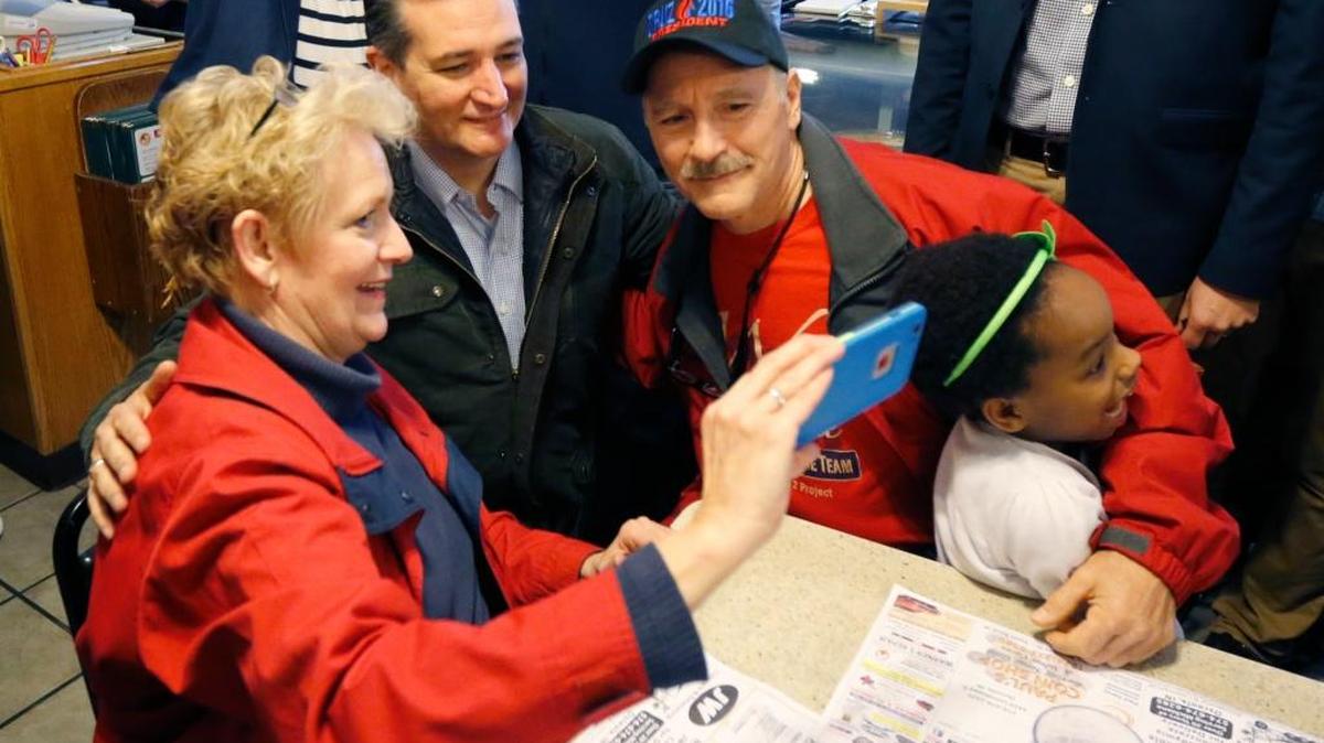 Republican presidential candidate Sen. Ted Cruz of Texas poses for a photograph during a visit to the Bravo Cafe during a campaign stop Monday, May 2, 2016, in Osceola, Ind.