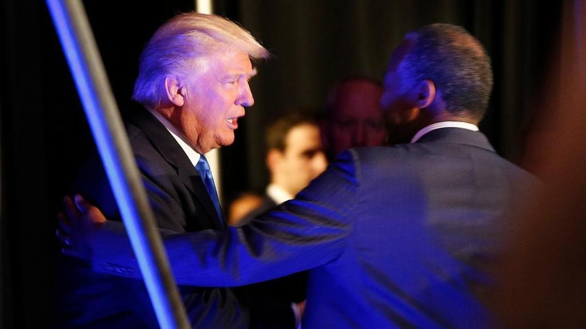 Republican presidential candidate Donald Trump greets former presidential candidate Dr. Ben Carson as he arrives to speak at a campaign rally in Manchester, N.H., on Thursday, Aug. 25, 2016.