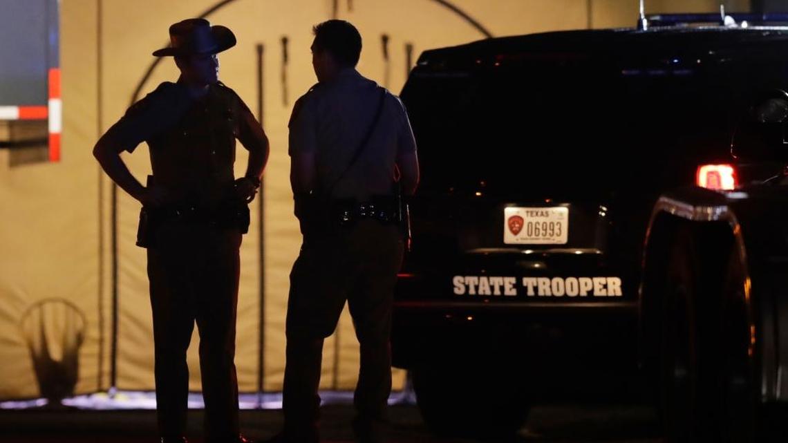 Law enforcement officials work at the scene of a shooting at the First Baptist Church of Sutherland Springs, Sunday in Sutherland Springs, Texas. A man dressed in black tactical-style gear and armed with an assault rifle opened fire inside the church in the small South Texas community on Sunday, killing and wounding many. The dead ranged in age from 5 to 72 years old.