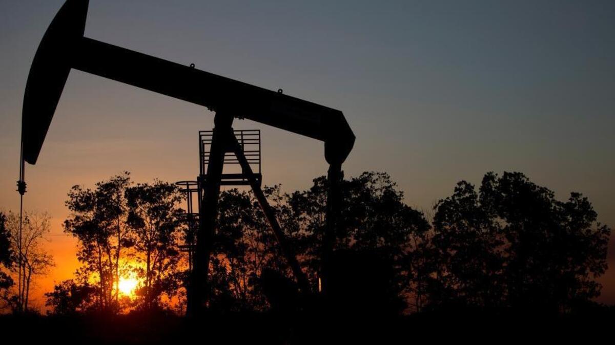 In this Feb. 19, 2015 photo, the sun sets behind an oil well in a field near El Tigre, a town within Venezuela's Hugo Chavez oil belt, formally known as the Orinoco Belt. President Nicolas Maduro, whose approval rating has plunged to around 25 percent, has no choice but to lean on state-fun oil company PDVSA to help Venezuela back on its feet and has been quietly trying to lure back foreign drillers.