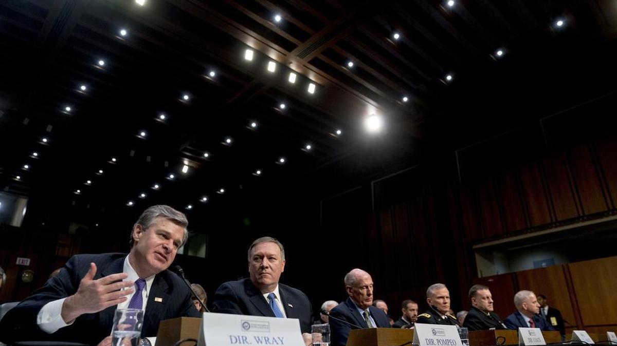 From left, FBI Director Christopher Wray, accompanied by CIA Director Mike Pompeo, Director of National Intelligence Dan Coats, Defense Intelligence Agency Director Robert Ashley, National Security Agency Director Adm. Michael Rogers, and National Geospatial-Intelligence Agency Director Robert Cardillo, speaks at a Senate Intelligence Committee hearing on worldwide threats Feb. 13, 2018.
