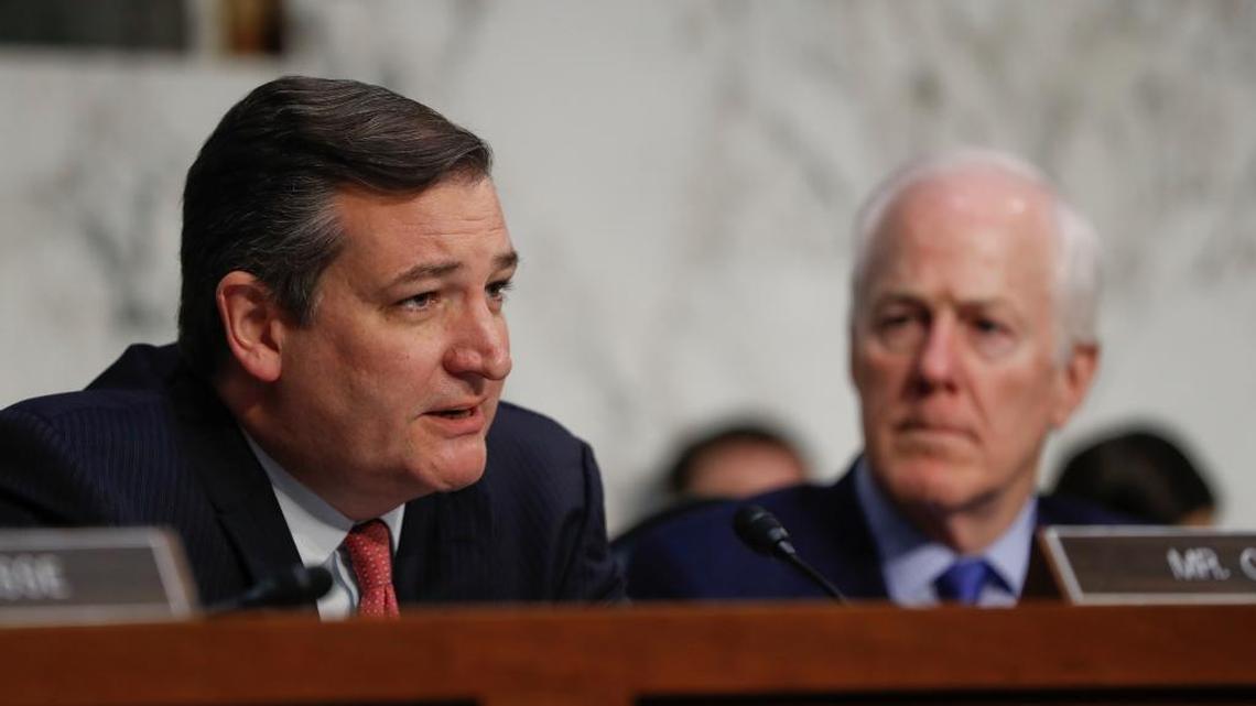 Sen. Ted Cruz, R-Texas, left, questions former Acting Attorney General Sally Yates and former National Intelligence Director James Clapper as Sen. John Cornyn, R-Texas, right, looks on.