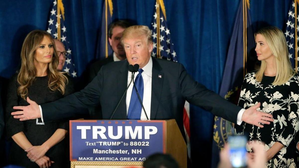 Republican presidential candidate, businessman Donald Trump speaks to supporters during a primary night rally, Tuesday, Feb. 9, 2016, in Manchester, N.H. At his side are his wife Melania Trump, left, and daughter Ivanka Trump, right.